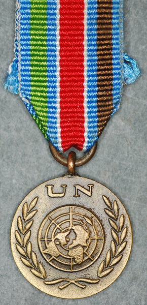Miniature United Nations peacekeeping medal.