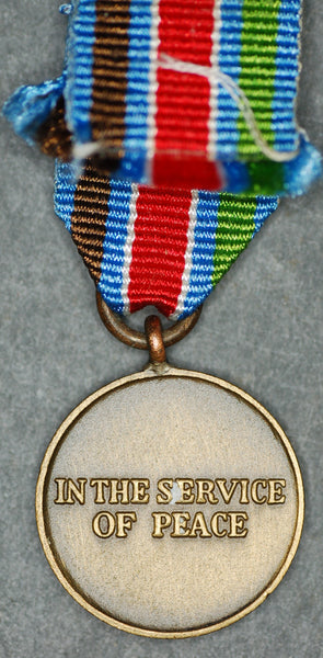 Miniature United Nations peacekeeping medal.