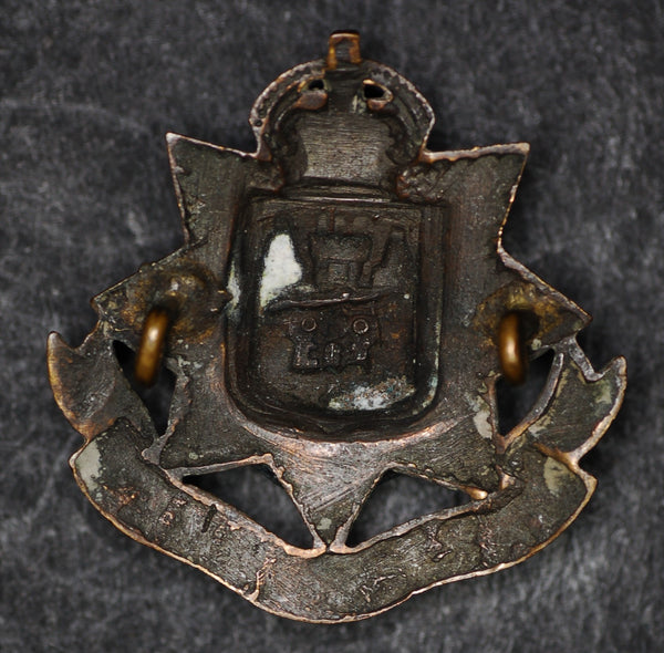Cap badge. WW1. East Surrey regiment. Economy issue.
