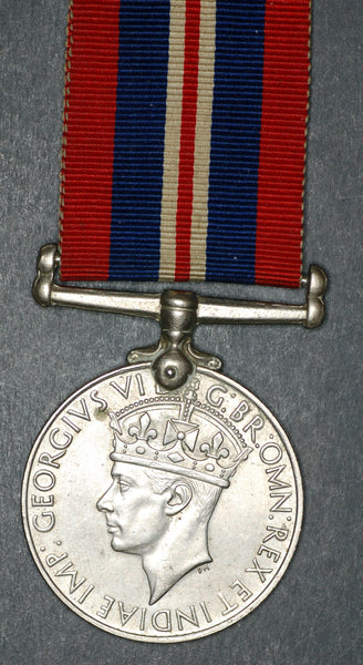 WW2. War service medal. Named. Mace.